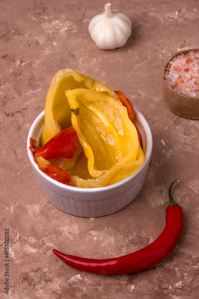 Fermented red and yellow bell peppers. Vegetarian food. Salted bell peppers. Pickled organic bell peppers. Homemade fermented foods. Food stocks. Fermented red and yellow bell peppers. Vegetarian food. Salted bell peppers. Pickled organic bell peppers. Homemade fermented foods. Food stocks.