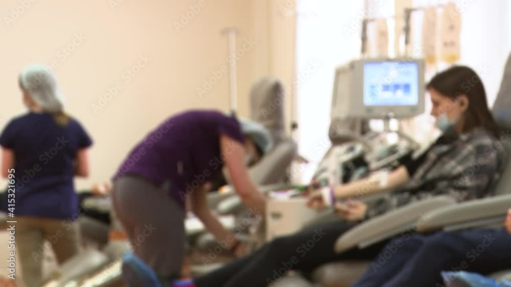 Donors donate blood while sitting in chairs. Unfocus. Video contains noises. Donors donate blood while sitting in chairs. Unfocus. Video contains noises.