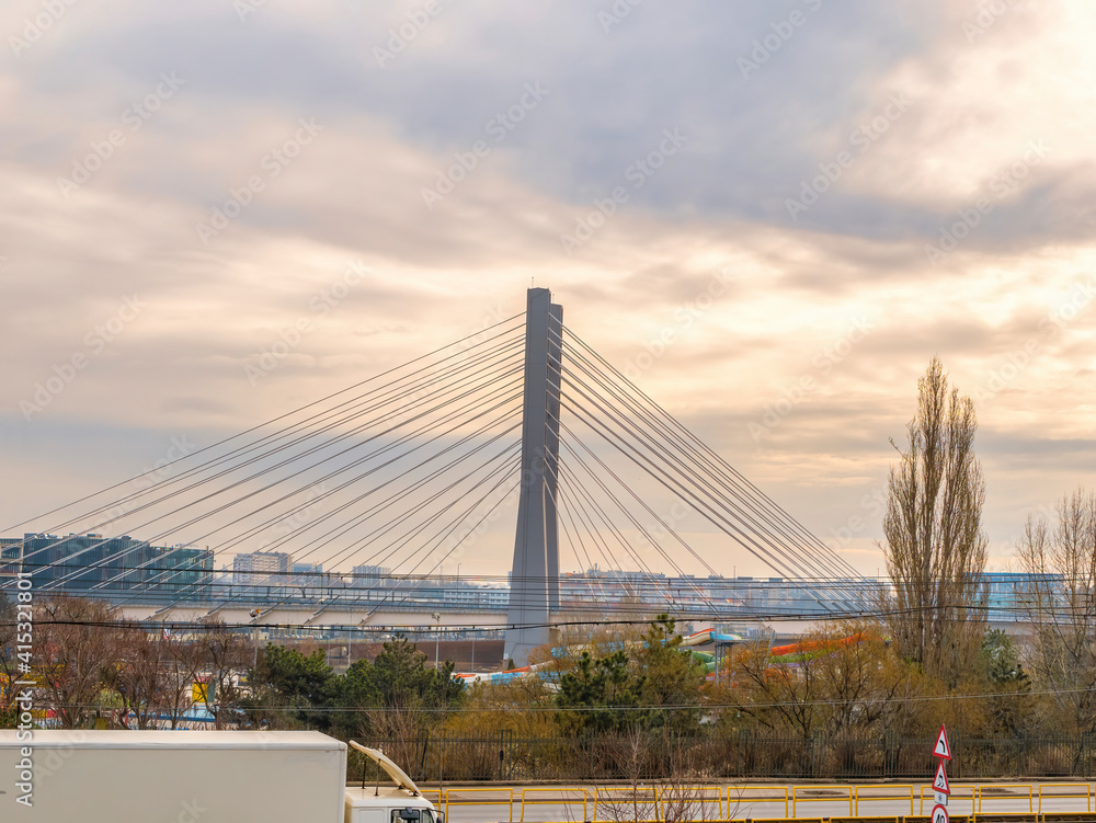 The newly built Ciurel Bridge at sunset, in Bucharest Romania. Steel wires bridge structure.