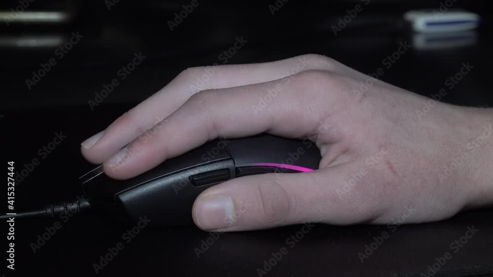 Child is playing on the computer, moving the mouse, trying to find new games. Child is playing on the computer, moving the mouse, trying to find new games.