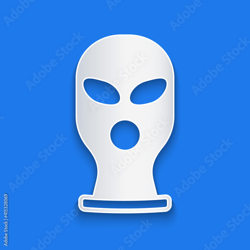 Paper cut Balaclava icon isolated on blue background. A piece of clothing for winter sports or a mask for a criminal or a thief. Paper art style. Vector.