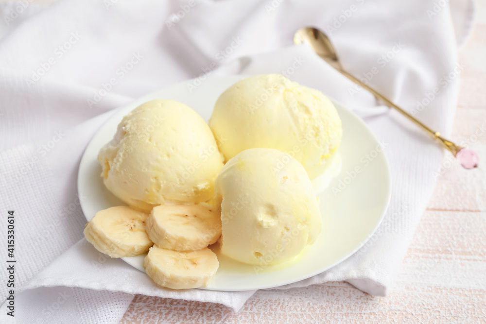 Tasty banana ice-cream on light wooden background Tasty banana ice-cream on light wooden background