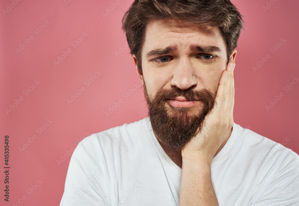 Upset man gesturing with hands stress emotions model pink background Upset man gesturing with hands stress emotions model pink background