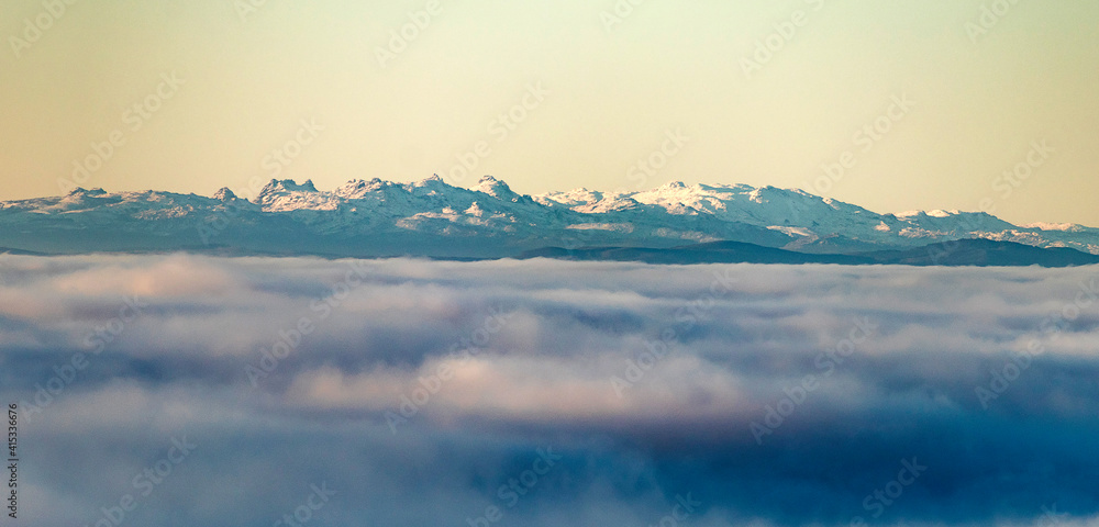 Full view of the snowy Sierra de Xurés-Geres above a sea of clouds Full view of the snowy Sierra de Xurés-Geres above a sea of clouds
