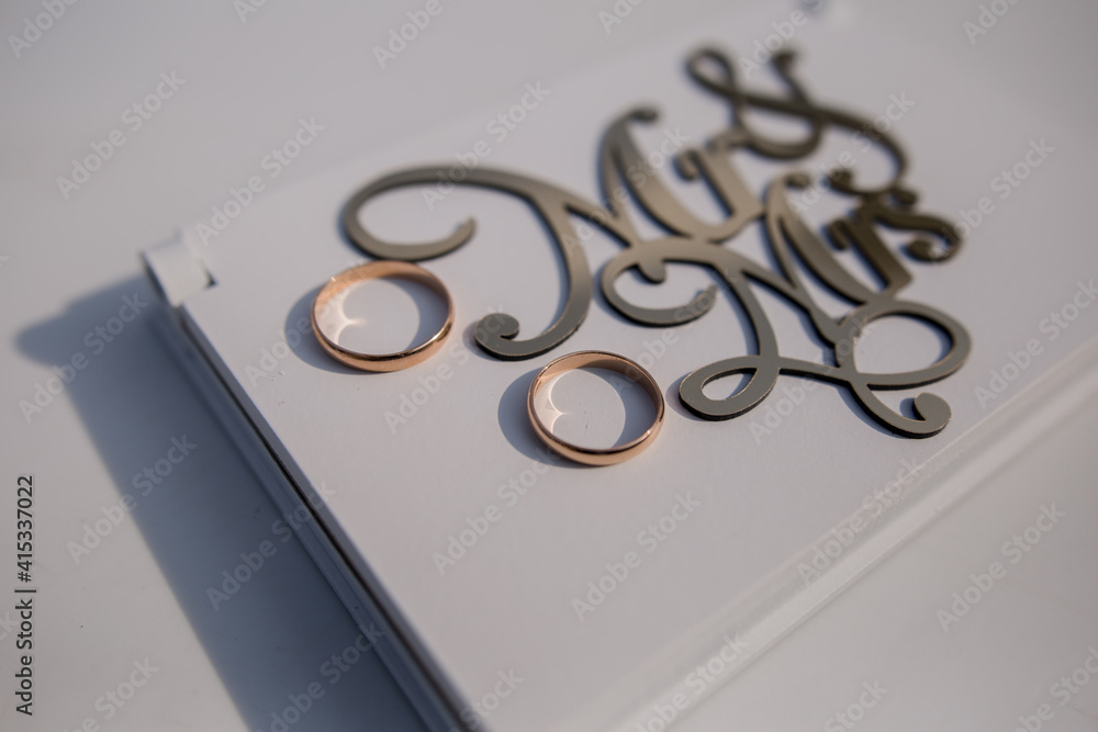 mr and mrs lettering with wedding rings Stock Photo | Adobe Stock