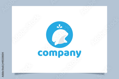 a cute beluga whale logo vector graphic with a beluga appears on the surface of water.