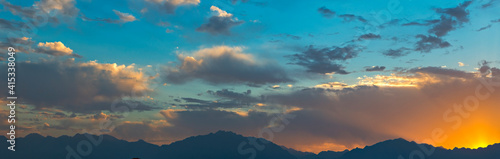 Panorama with colorful clouds above mountains, Middle East