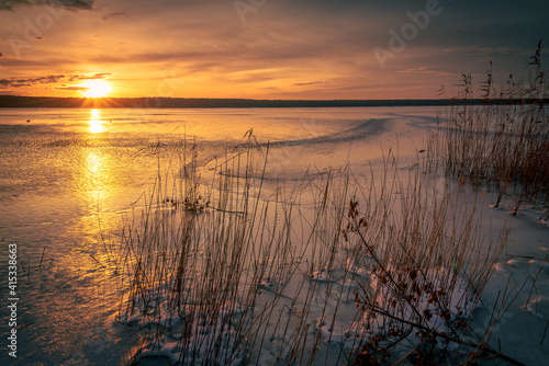 Fototapeta Naklejka Na Ścianę i Meble -  Beautiful sunset on the frozen winter lake, zalew zemborzycki lublin poland