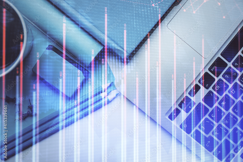 Double exposure of forex graph drawing over desktop background with computer. Concept of financial analysis. Top view. Double exposure of forex graph drawing over desktop background with computer. Concept of financial analysis. Top view.
