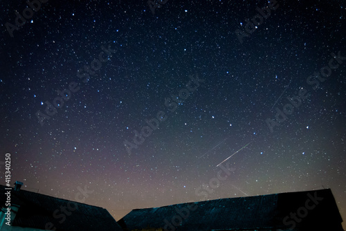 night sky with stars and perseids