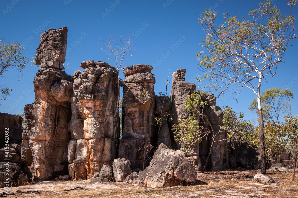 Landscape view of sandstone formations reminisicent of derelict buildings in the Lost City, Litchfield National Park, Northern Territory, Australia.