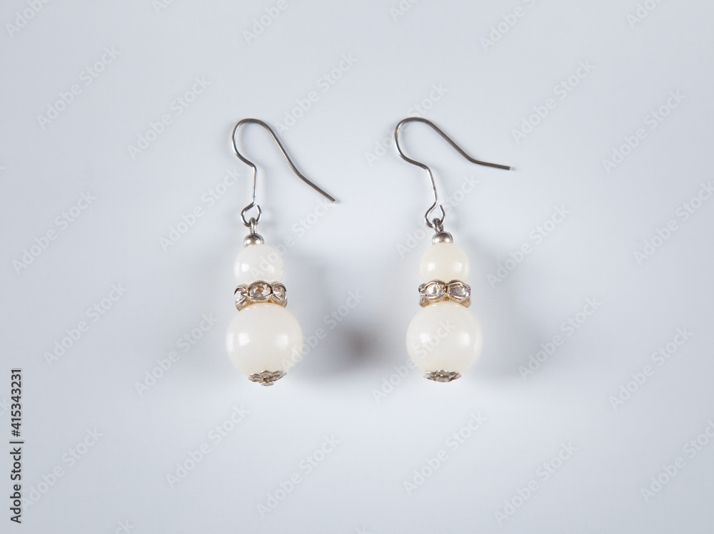 Earrings isolated on white background. Concept of fashion. Earrings isolated on white background. Concept of fashion.