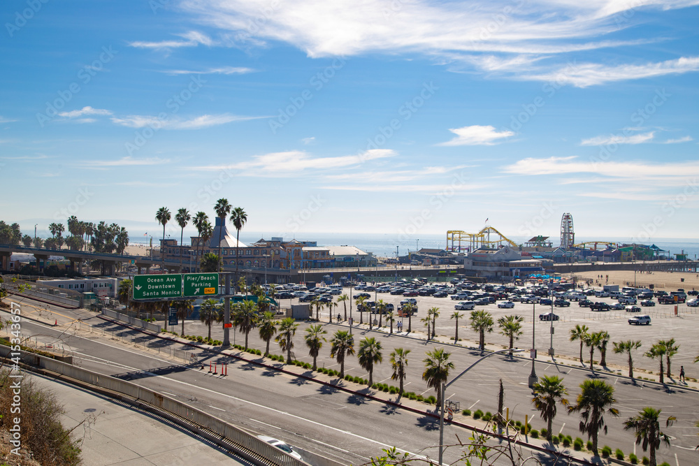 Parking zone at Santa Monica beach in los Angeles, California with pier
