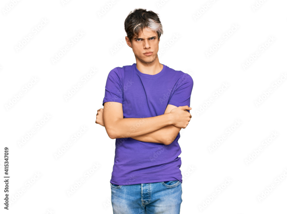 Young hispanic man wearing casual clothes skeptic and nervous, disapproving expression on face with crossed arms. negative person.
