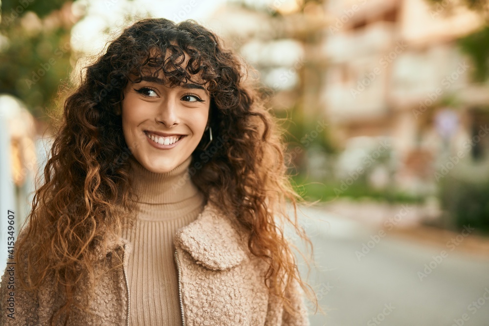 Young hispanic woman smiling happy standing at the city Young hispanic woman smiling happy standing at the city