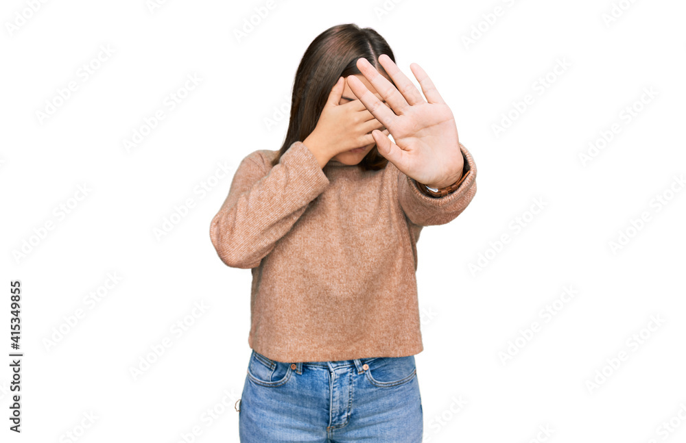 Young beautiful woman wearing casual clothes covering eyes with hands and doing stop gesture with sad and fear expression. embarrassed and negative concept. Young beautiful woman wearing casual clothes covering eyes with hands and doing stop gesture with sad and fear expression. embarrassed and negative concept.