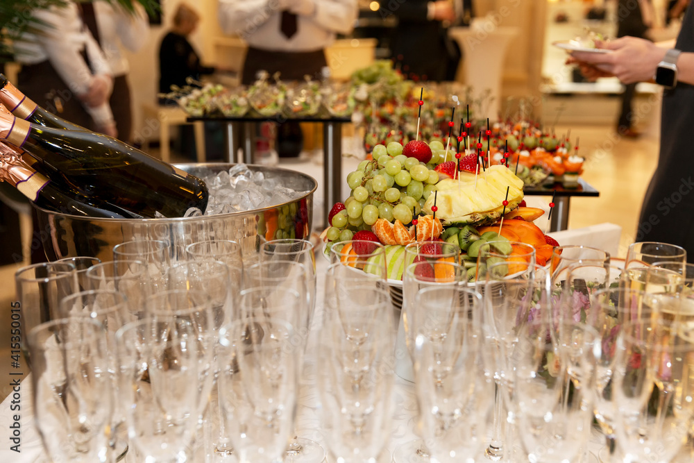 Buffet festive table with wine and snacks. Catering for business meetings, events and celebrations.