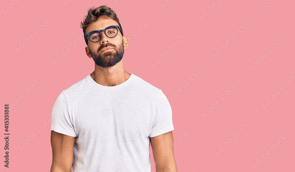 Young hispanic man wearing casual clothes and glasses looking sleepy and tired, exhausted for fatigue and hangover, lazy eyes in the morning. Young hispanic man wearing casual clothes and glasses looking sleepy and tired, exhausted for fatigue and hangover, lazy eyes in the morning.