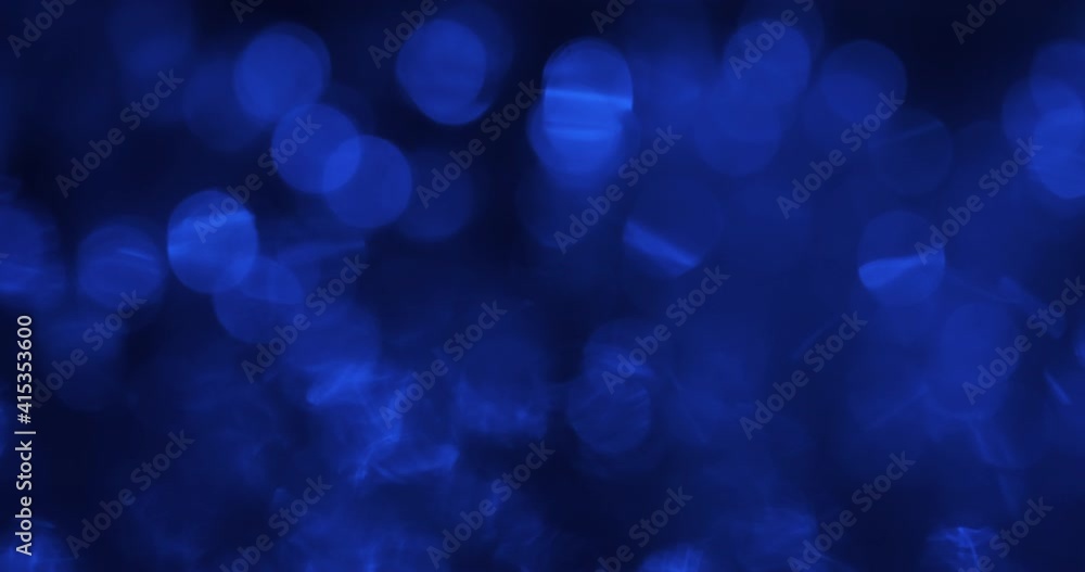 Abstract movement of blue defocused lights. Blinking and rippling blue bokeh. Abstract movement of blue defocused lights. Blinking and rippling blue bokeh.