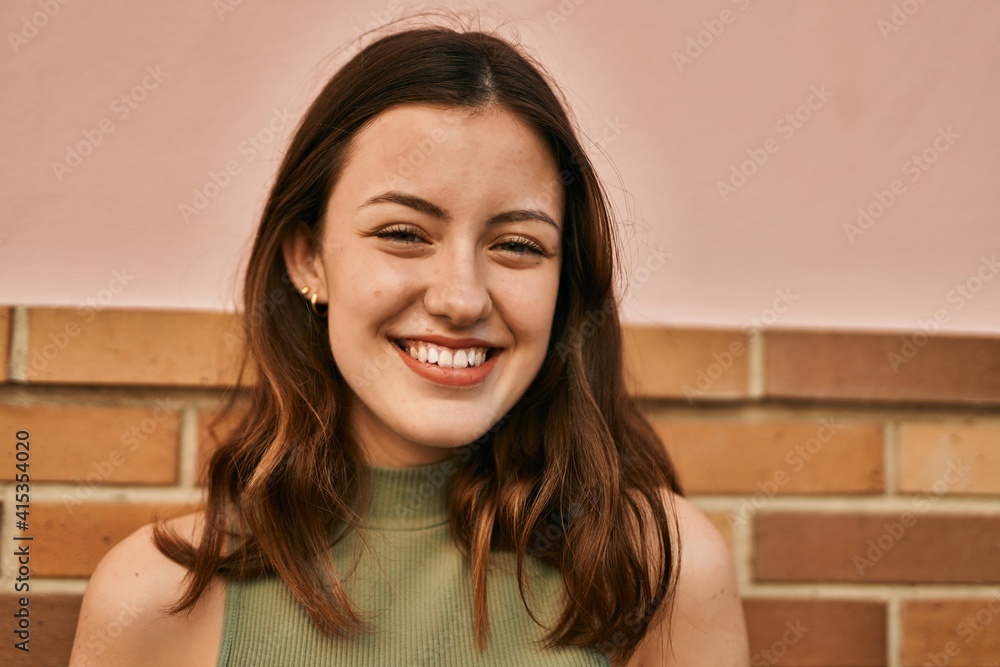 Young caucasian girl smiling happy standing at the city. Young caucasian girl smiling happy standing at the city.
