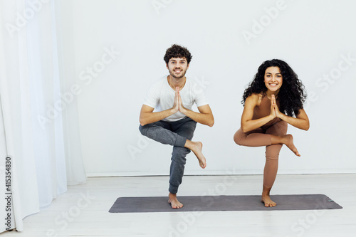 Man and woman engaged in yoga asana sports gymnastics fitness