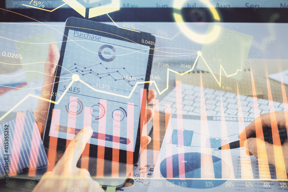 Multi exposure of man's hands holding and using a phone and financial chart drawing. Market analysis concept. Multi exposure of man's hands holding and using a phone and financial chart drawing. Market analysis concept.