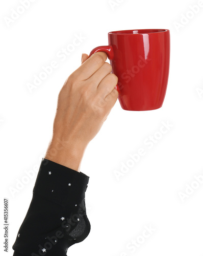 Woman holding elegant red cup on white background, closeup