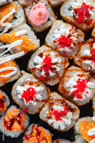 Sushi rolls with sauce close-up