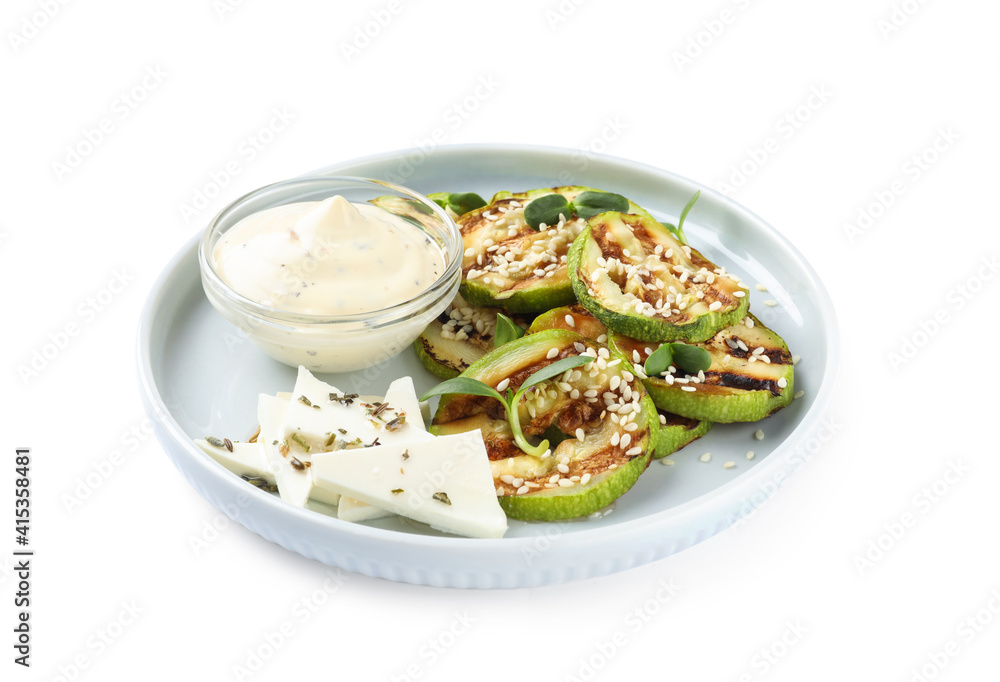 Delicious grilled zucchini slices served with sauce and cheese on white background Delicious grilled zucchini slices served with sauce and cheese on white background