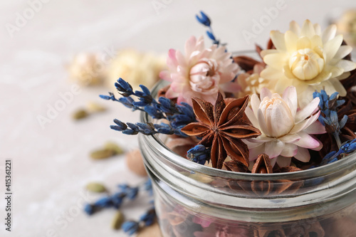 Aroma potpourri with different spices in jar  closeup view. Space for text