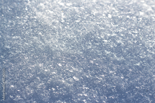 snowflakes glisten in the sun close-up