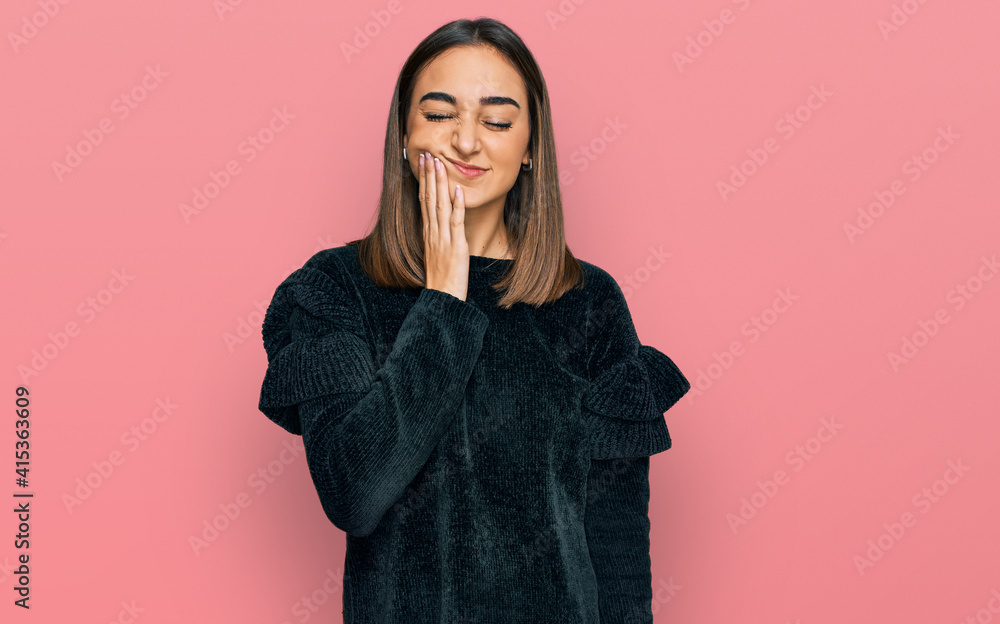 Beautiful brunette woman wearing elegant sweater touching mouth with hand with painful expression because of toothache or dental illness on teeth. dentist Beautiful brunette woman wearing elegant sweater touching mouth with hand with painful expression because of toothache or dental illness on teeth. dentist