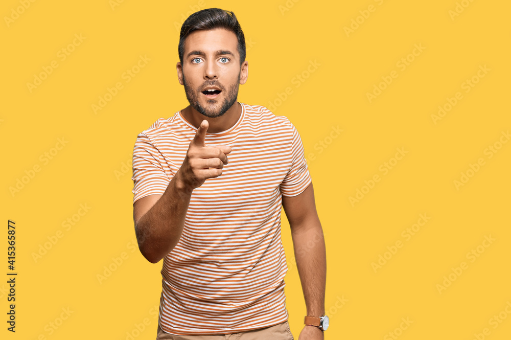Handsome hispanic man wearing casual clothes pointing displeased and frustrated to the camera, angry and furious with you Handsome hispanic man wearing casual clothes pointing displeased and frustrated to the camera, angry and furious with you
