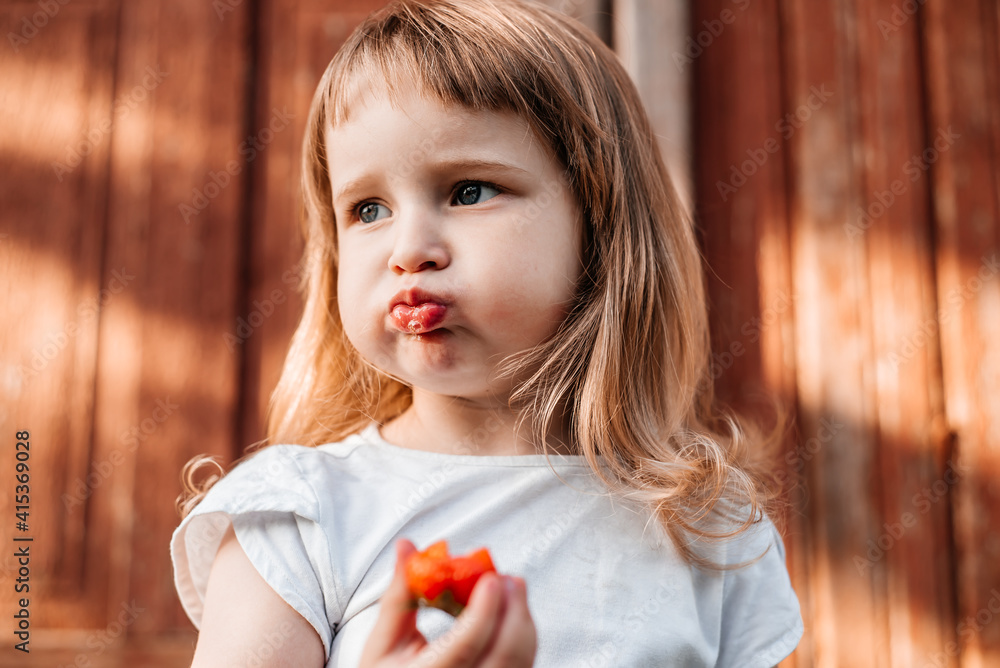 Child with food. Healthy eating Strawberry Child with food. Healthy eating Strawberry