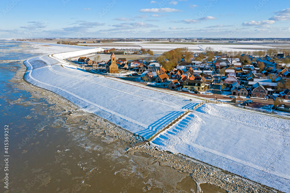 Aerial from the village Wierum on a beautiful winter day in the Netherlands