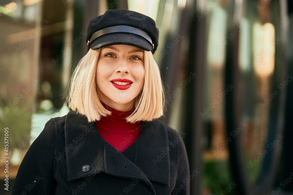 Young blonde woman smiling happy standing at the city. Young blonde woman smiling happy standing at the city.