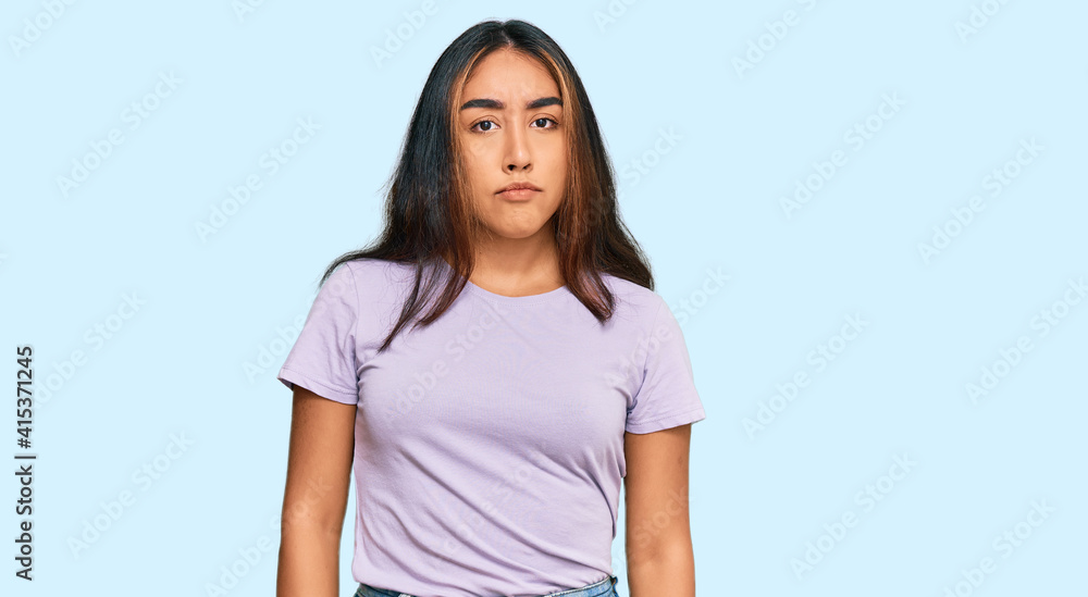 Young latin woman wearing casual clothes depressed and worry for distress, crying angry and afraid. sad expression. Young latin woman wearing casual clothes depressed and worry for distress, crying angry and afraid. sad expression.