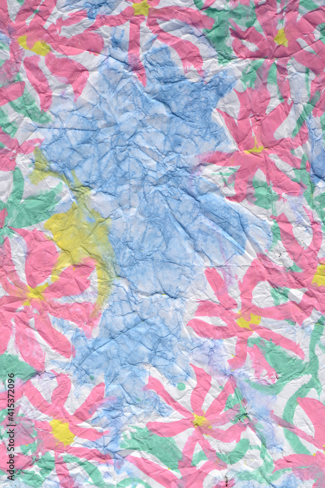pink flowers on blue crumpled paper