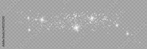 The dust sparks and golden stars shine with special light. Vector sparkles on a transparent background.