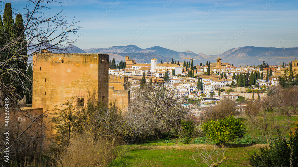 View on the Alhambra fortifications and the city of Granada from the Generalife gardens in Andalusia (Spain) View on the Alhambra fortifications and the city of Granada from the Generalife gardens in Andalusia (Spain)