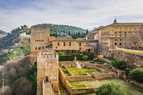 View on the ruins of the Alcazaba, the Carlos V palaca and the Generalife from the rampart of the Alcazaba, the fortress of the Alhambra complex (Andalusia, Spain)