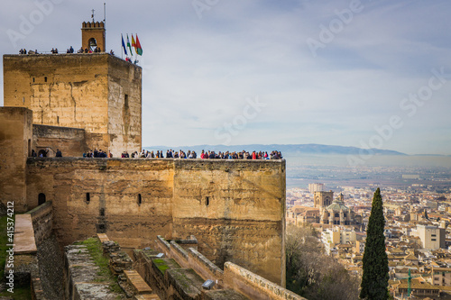 View on the city of Granada (Spain) and the Torre de le Vela, a watch tower of the Alcazaba, the fortress of the Alhambra complex (Andalusia)