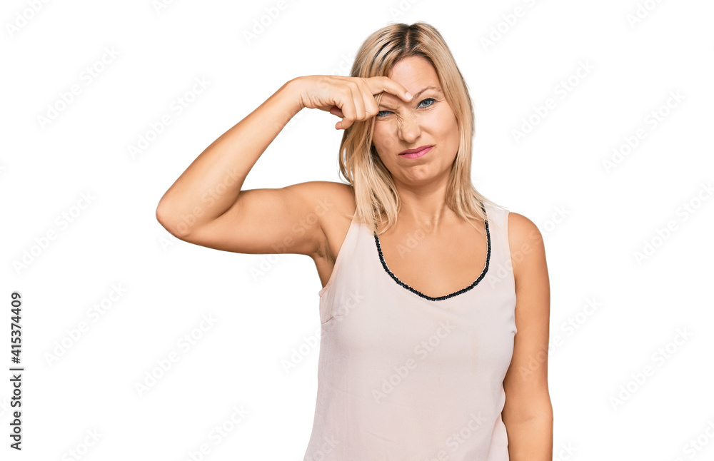 Middle age caucasian woman wearing casual clothes pointing unhappy to pimple on forehead, ugly infection of blackhead. acne and skin problem Middle age caucasian woman wearing casual clothes pointing unhappy to pimple on forehead, ugly infection of blackhead. acne and skin problem