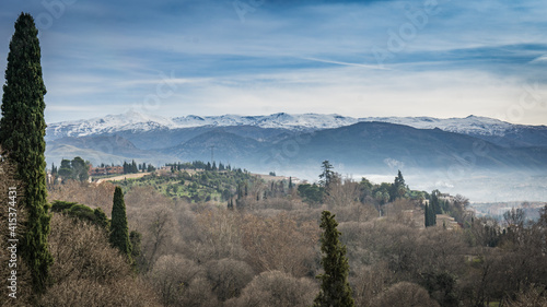 View on the Sierra Nevada in Andalucia on a misty winter morning, from the Alhambra palace in Granada (Spain)
