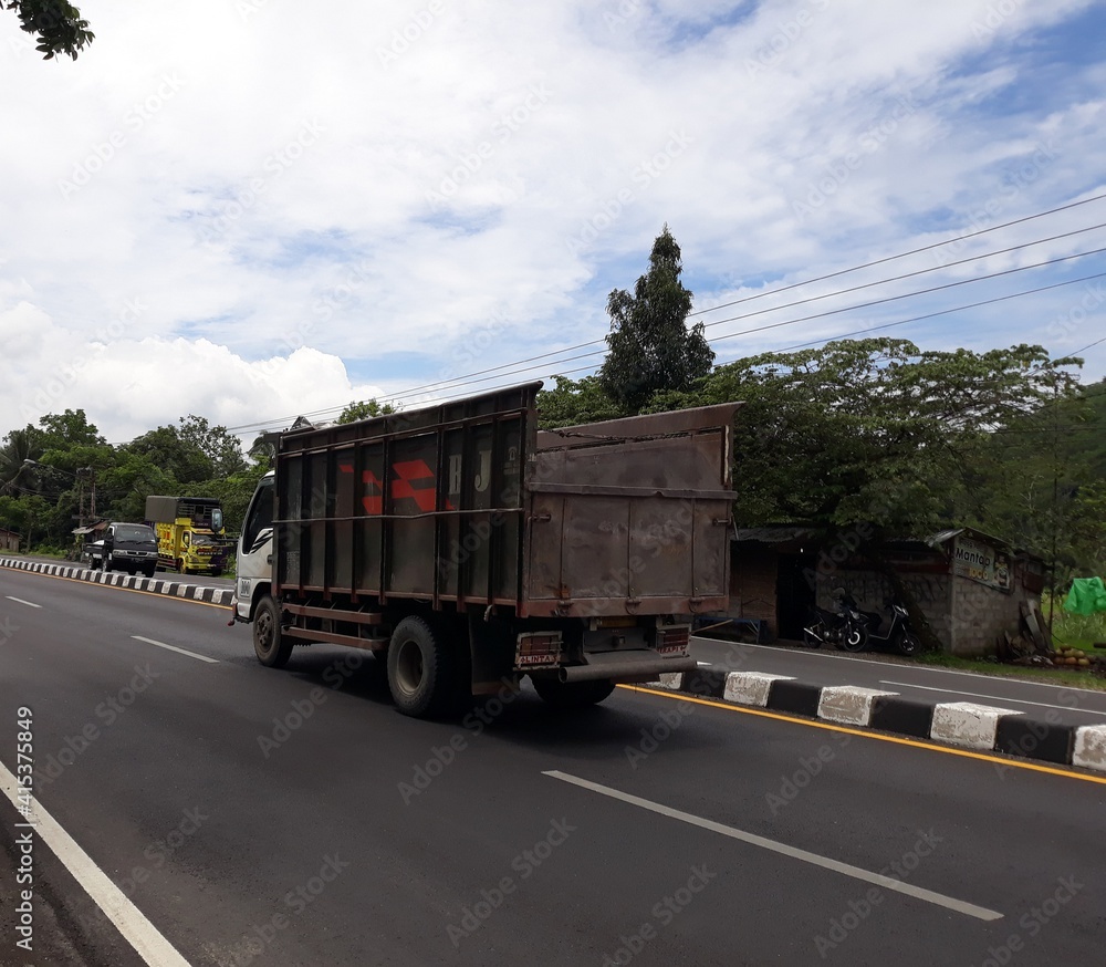 truck on the highway, or truk lewat di jalan, Magelang, Jawa Tengah, Indonesia