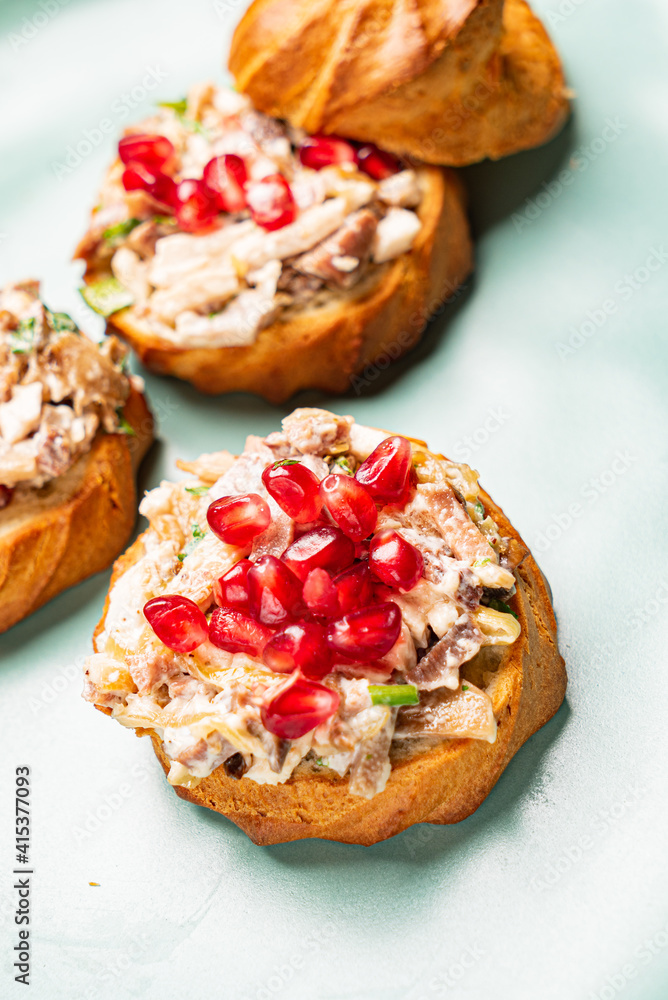 canape with meat salad and pomegranate seeds canape with meat salad and pomegranate seeds