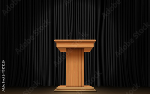 wooden announcement podium and black curtain on the stage