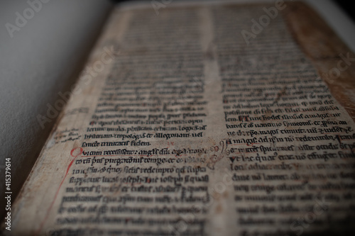 Medieval manuscript hand written on vellum with rubricated and illuminated initials, from a religious text from the C13th. 