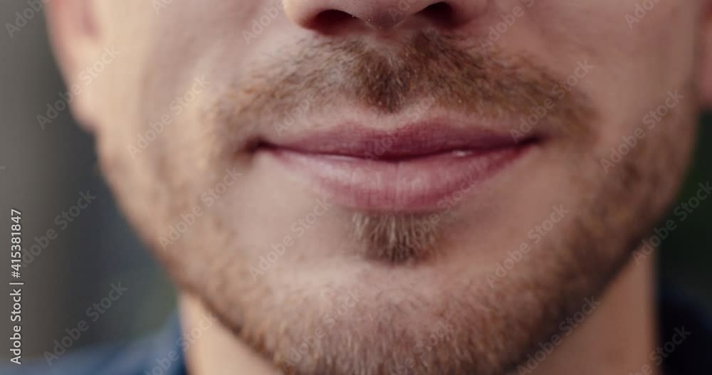 Close up portrait of handsome Caucasian man with mustache looking at camera and smiling while showing teeth. Close up portrait of handsome Caucasian man with mustache looking at camera and smiling while showing teeth.