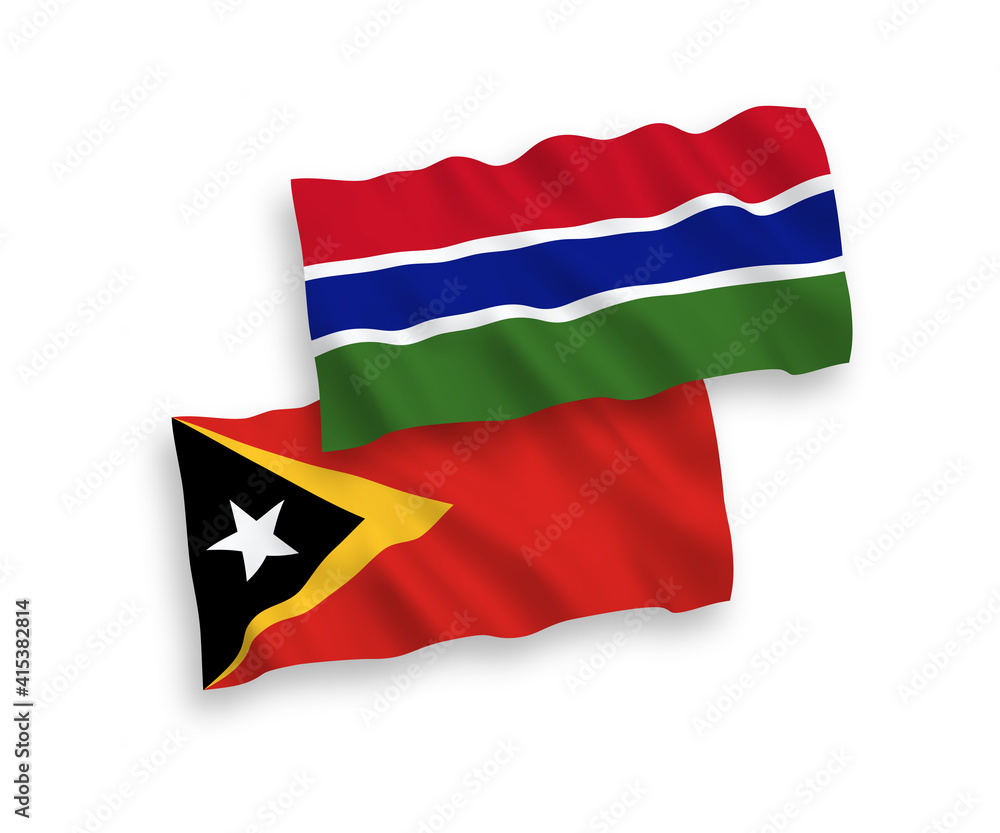 National vector fabric wave flags of East Timor and Republic of Gambia isolated on white background. 1 to 2 proportion.